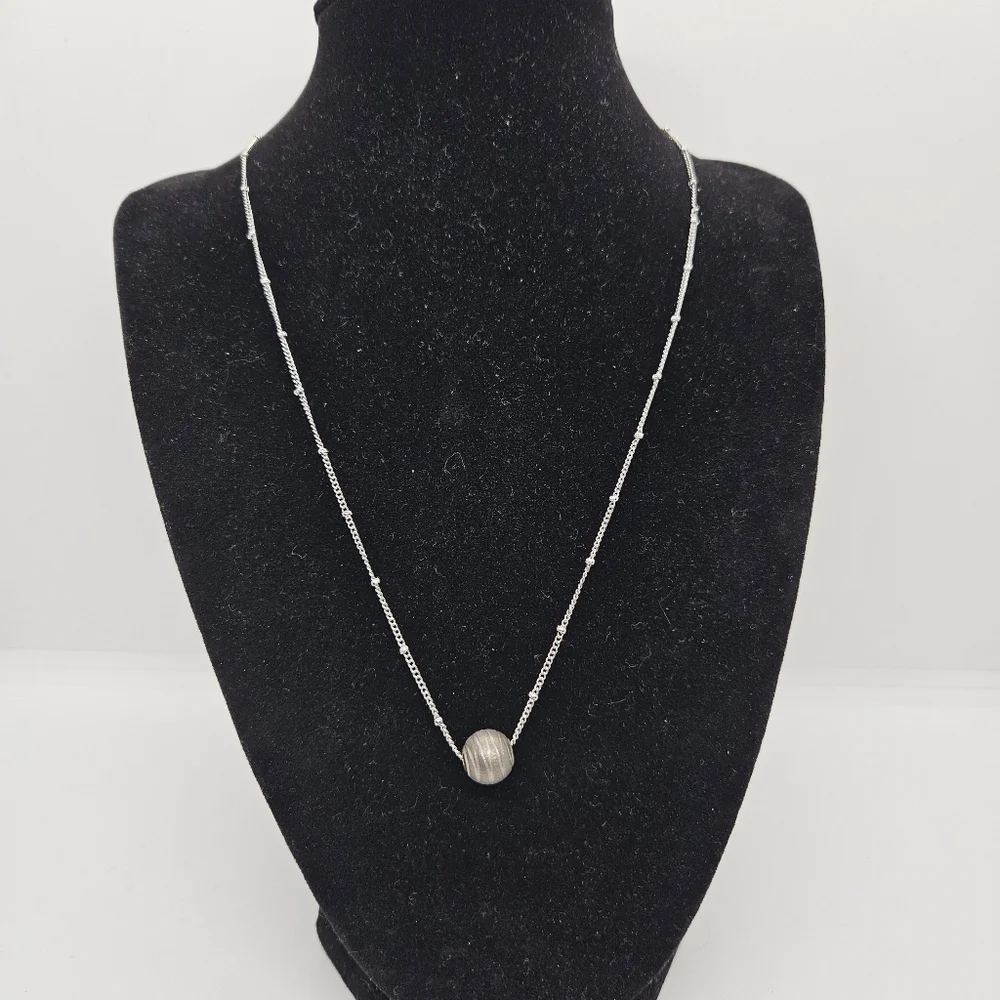 silver tone chain necklace with gray banded bead